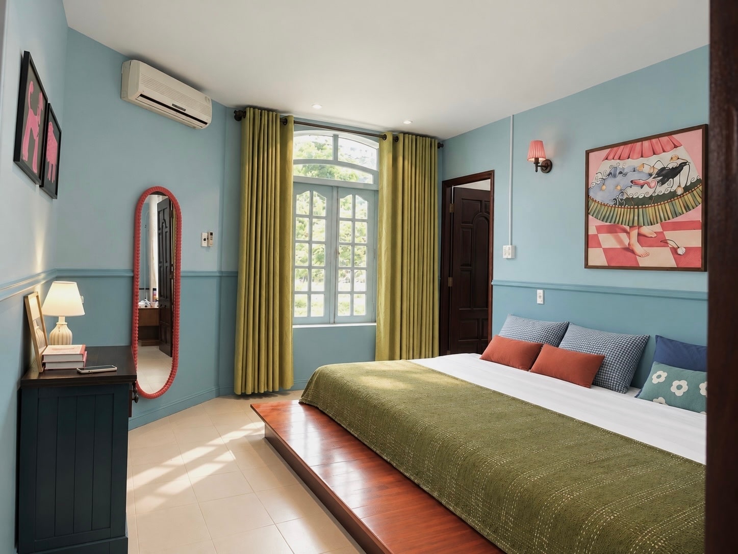 Wide view of MARE with the bed, arched window, coral mirror and painted artwork