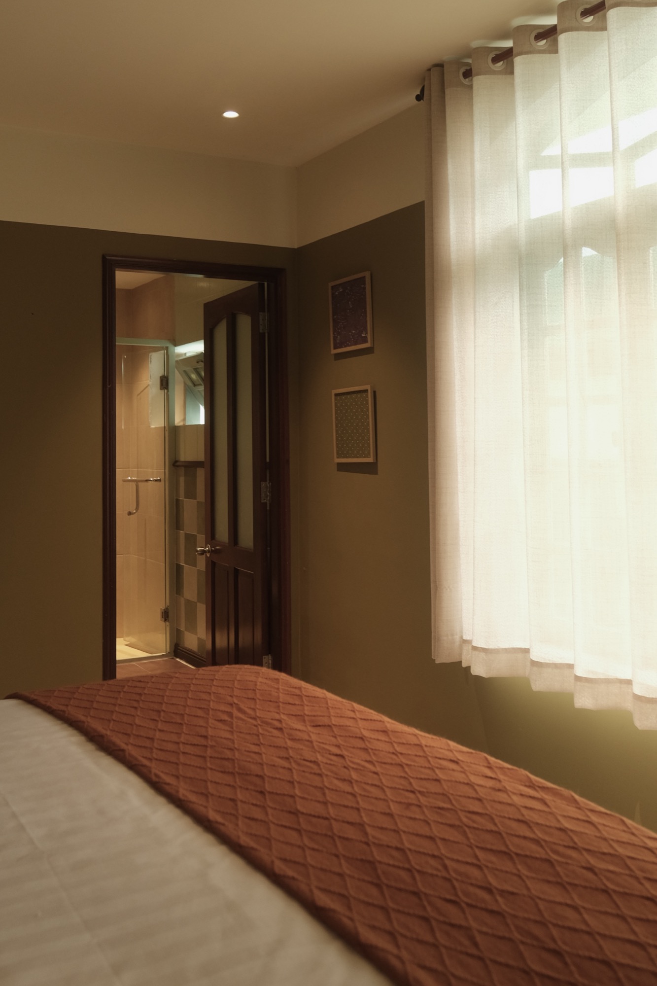 SERA's bright window beside the private bathroom doorway